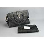 YVES SAINT LAURENT CABAS CHYC. Black leather tote bag with Y metal plaque. With dust bag. Approx.