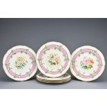 SET OF SIX VICTORIAN PORCELAIN DESSERT PLATES with a floral and gilt border surrounding central