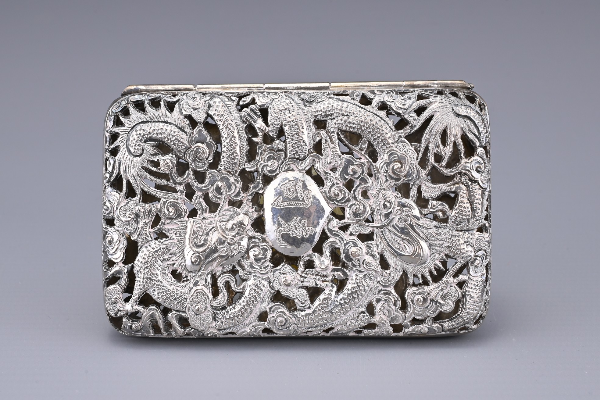 A CHINESE SILVER CIGARETTE CASE, 19/20TH CENTURY. Both covers with pierced and embossed decoration