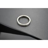 18CT WHITE GOLD DIAMOND ETERNITY RING. Twenty-nine round brilliant cut diamonds approx. 0.97ct total