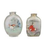TWO INSIDE-PAINTED GLASS SNUFF BOTTLES. To include an ovoid bottle painted with monkey and goats