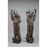 A PAIR OF CHINESE CARVED WOOD AND SILVER WIRE INLAY FIGURES, LATE 19TH CENTURY. A mirrored pair of