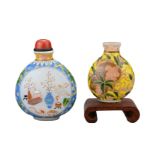 TWO VINTAGE CHINESE GLASS SNUFF BOTTLES. Each decorated in polychrome enamels, one yellow ground