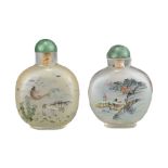 TWO CHINESE INSIDE-PAINTED GLASS SNUFF BOTTLES. One decorated with various fish and the other with