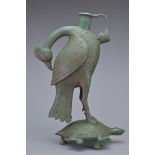 A BRONZE PHOENIX AND TURTLE TRIPOD EWER. In the form of a phoenix with its head turned back standing