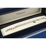 CHOPARD 18CT WHITE GOLD BRACELET WITH DIAMOND CHARM. Single square charm