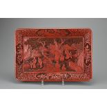 A LARGE CHINESE CINNABAR LACQUER TRAY, QING DYNASTY. Carved with scholars in landscape scene