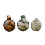 THREE CHINESE GLASS SNUFF BOTTLES. Coloured glass imitation agate with splashes of black. Two with