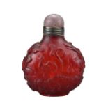 A CHINESE RUBY-RED 'ZODIAC' GLASS SNUFF BOTTLE, QING DYNASTY. The circular cut glass bottle