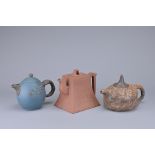 THREE CHINESE YIXING POTTERY TEAPOTS. Of various forms each with maker's marks to bases and