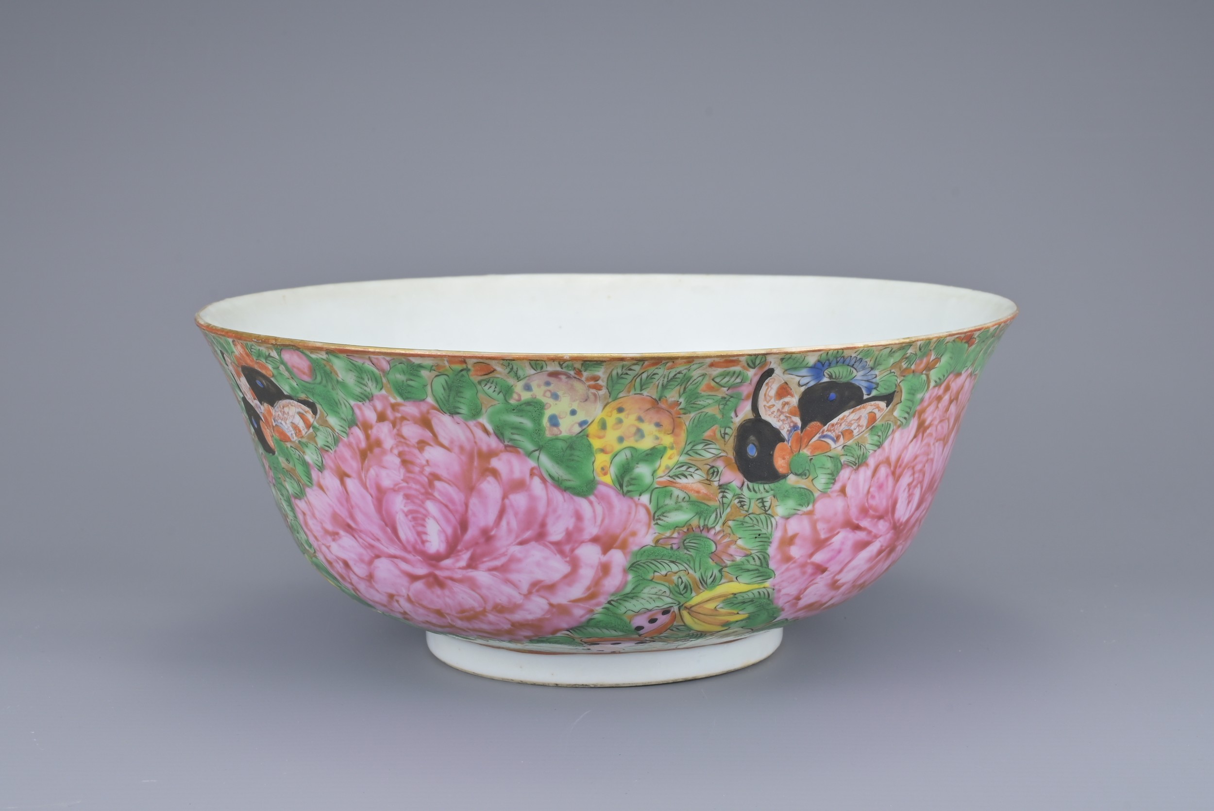A CHINESE FAMILLE ROSE PORCELAIN BOWL, 19TH CENTURY. Decorated with four large peony blossoms.