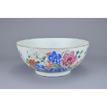 A CHINESE FAMILLE ROSE PORCELAIN BOWL, 18TH CENTURY. Enamelled decoration of flowers in garden