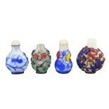 FOUR CHINESE PEKING GLASS SNUFF BOTTLES. Each with coloured overlay on white and clear glass bottles