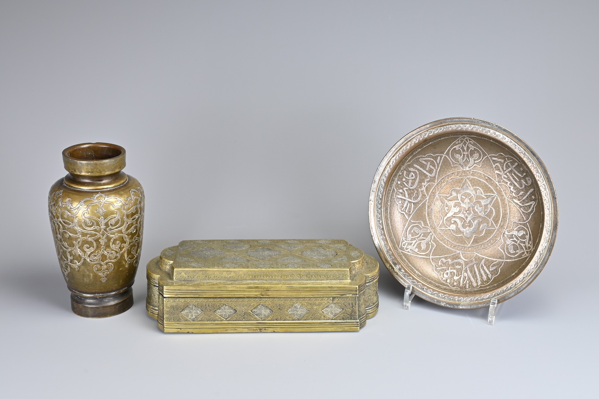 THREE MIDDLE EASTERN METALWARE ITEMS, 19/20TH CENTURY. To include a heavy bronze box with four