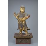 A LARGE GILT LACQUERED WOOD FIGURE OF WEITO, MING DYNASTY. The bodhisattva dressed as a warrior in