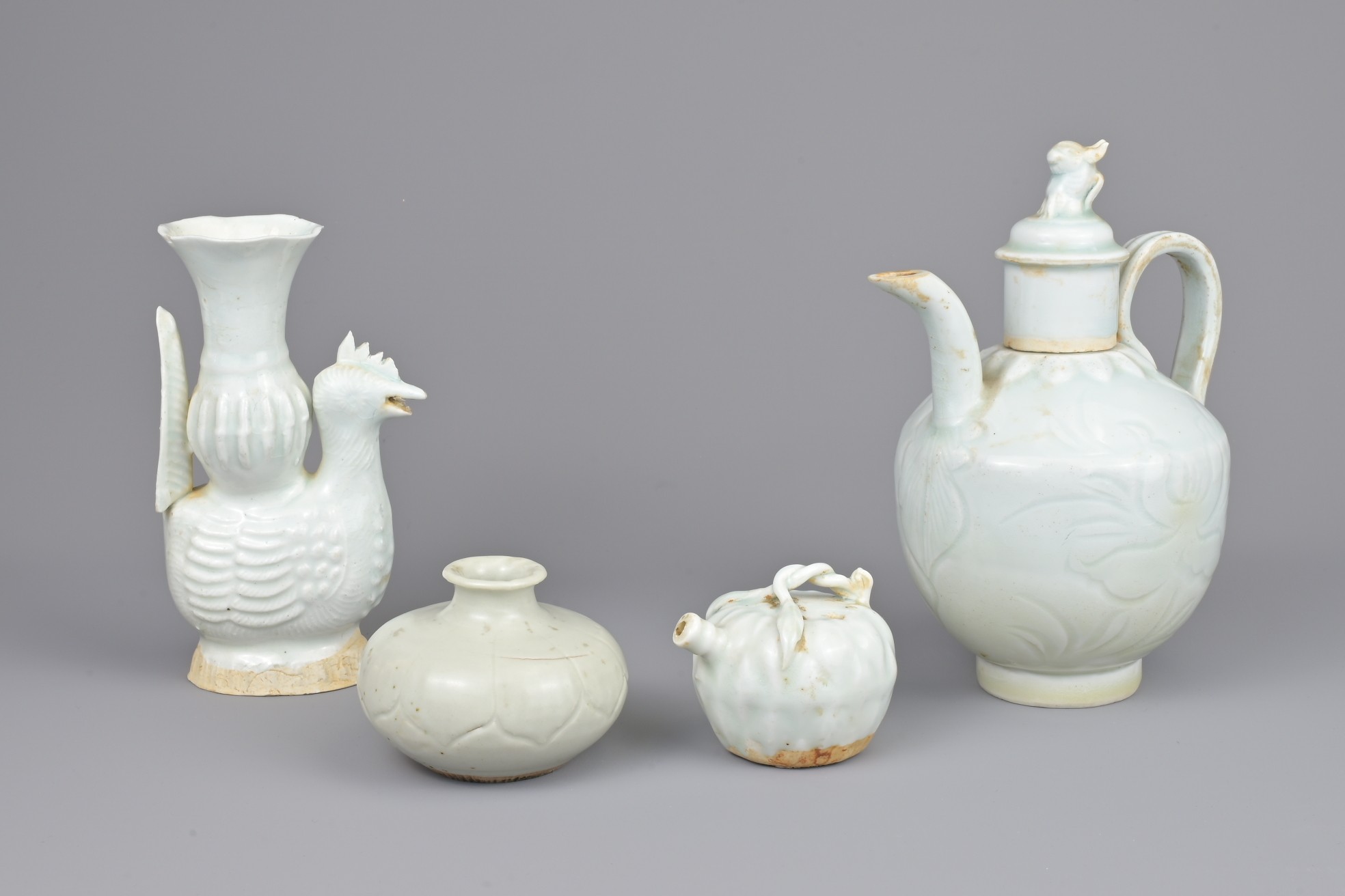 FOUR CHINESE QINGBAI PORCELAIN ITEMS. To include a jarlet, chicken form ewer, water dropper in the