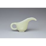 A CHINESE PALE CELADON JADE CUP. Of slender form with a looped handle and curved spout. 10.5cm