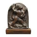 AN INDIAN OR NEPALESE STONE STELE FIGURE OF HANUMAN, 19TH CENTURY OR EARLIER