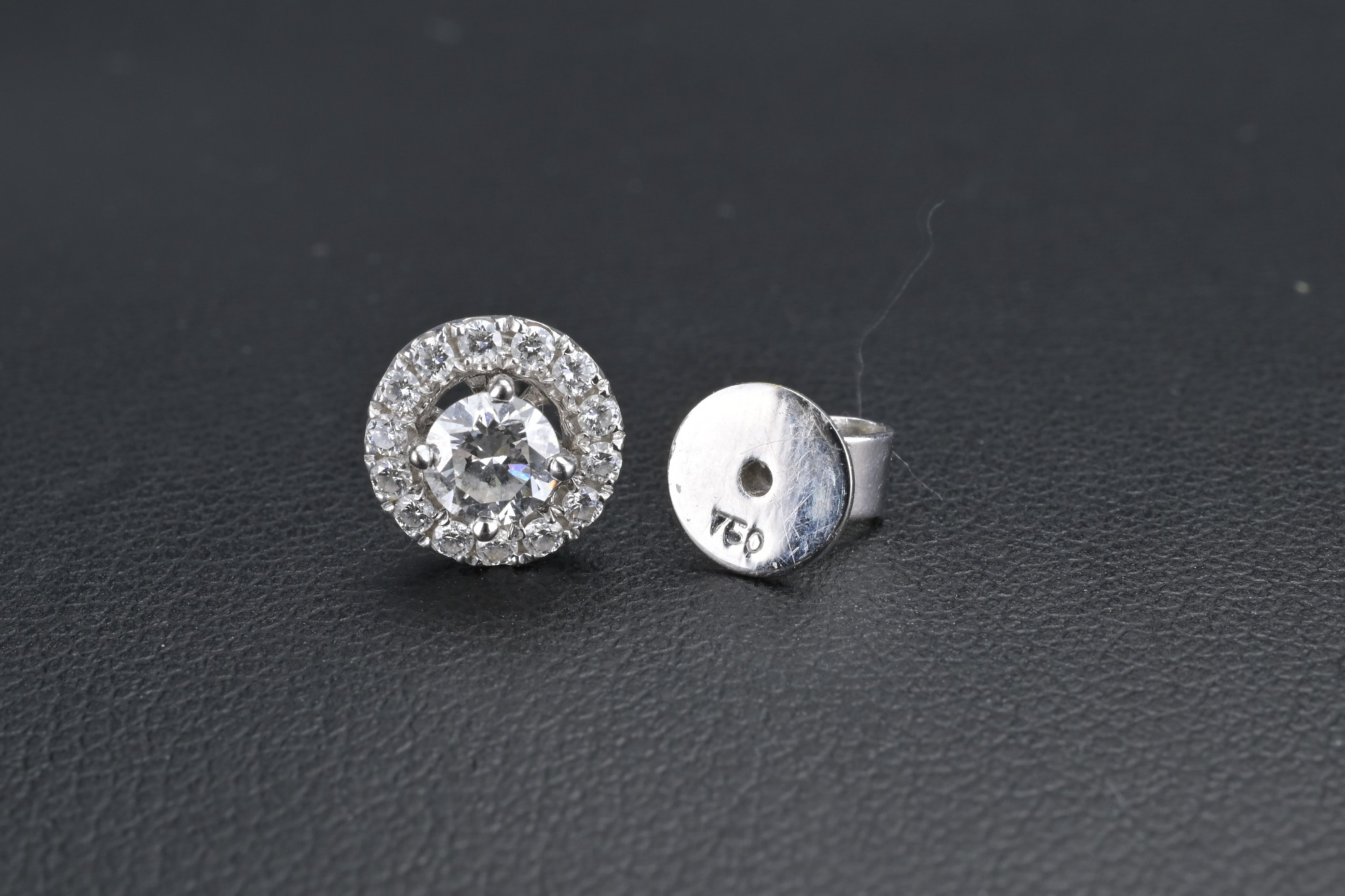 A PAIR OF 18KT WHITE GOLD AND DIAMOND CLUSTER EARRING STUDS. The central diamond flanked by a - Image 2 of 6