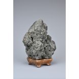 A CHINESE YING SCHOLAR ROCK, QING DYNASTY. Blackish-grey tone stone upright in the form of a