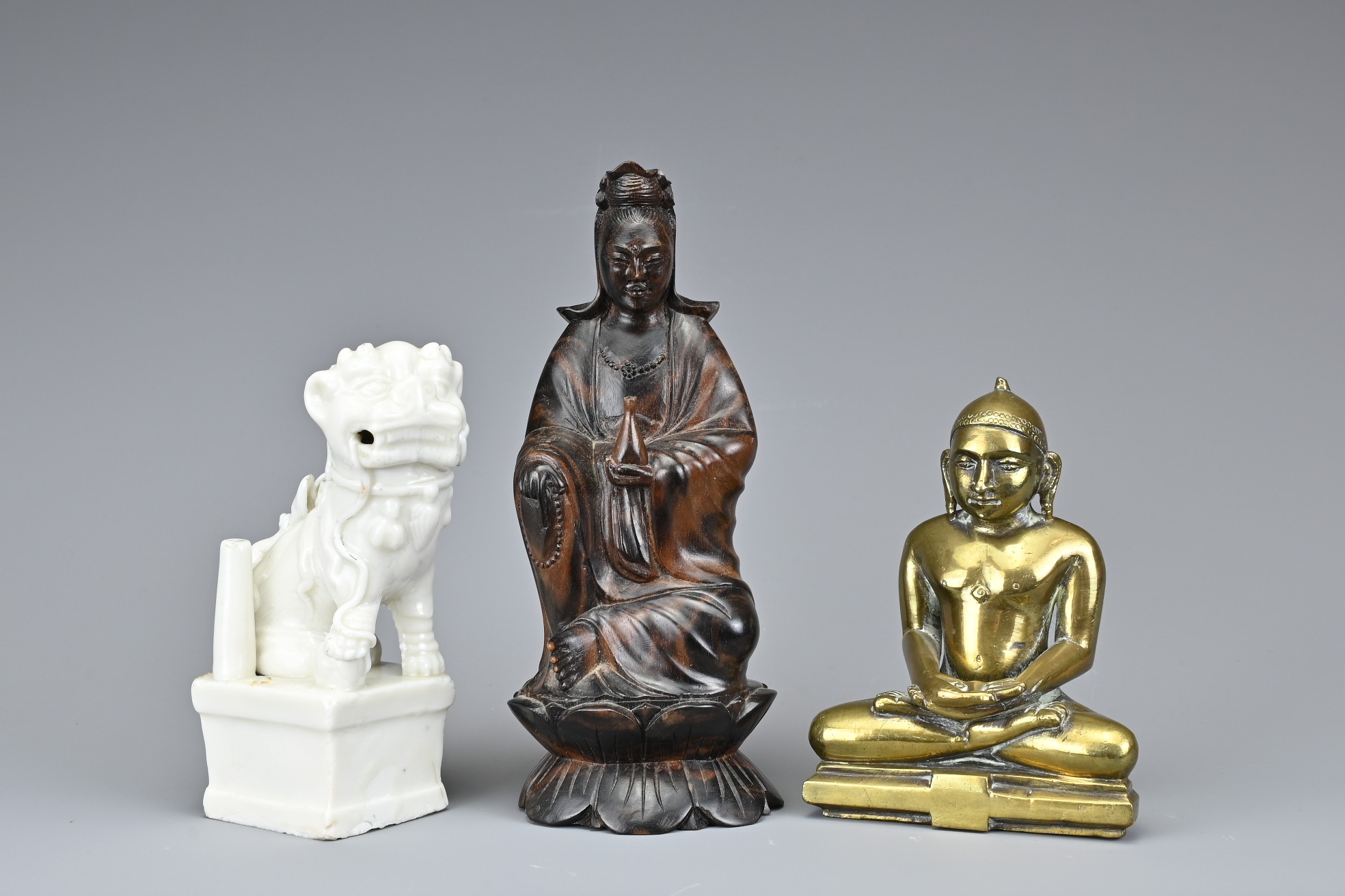 A GROUP OF BRONZE, CERAMIC AND WOOD ITEMS. Comprising an 18th century Blanc de Chine figure of dog