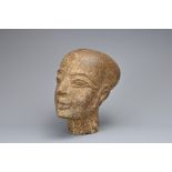 AN EGYPTIAN STONE HEAD OF FEMALE. Modelled on the daughter of Pharaoh Akhenaten and wife