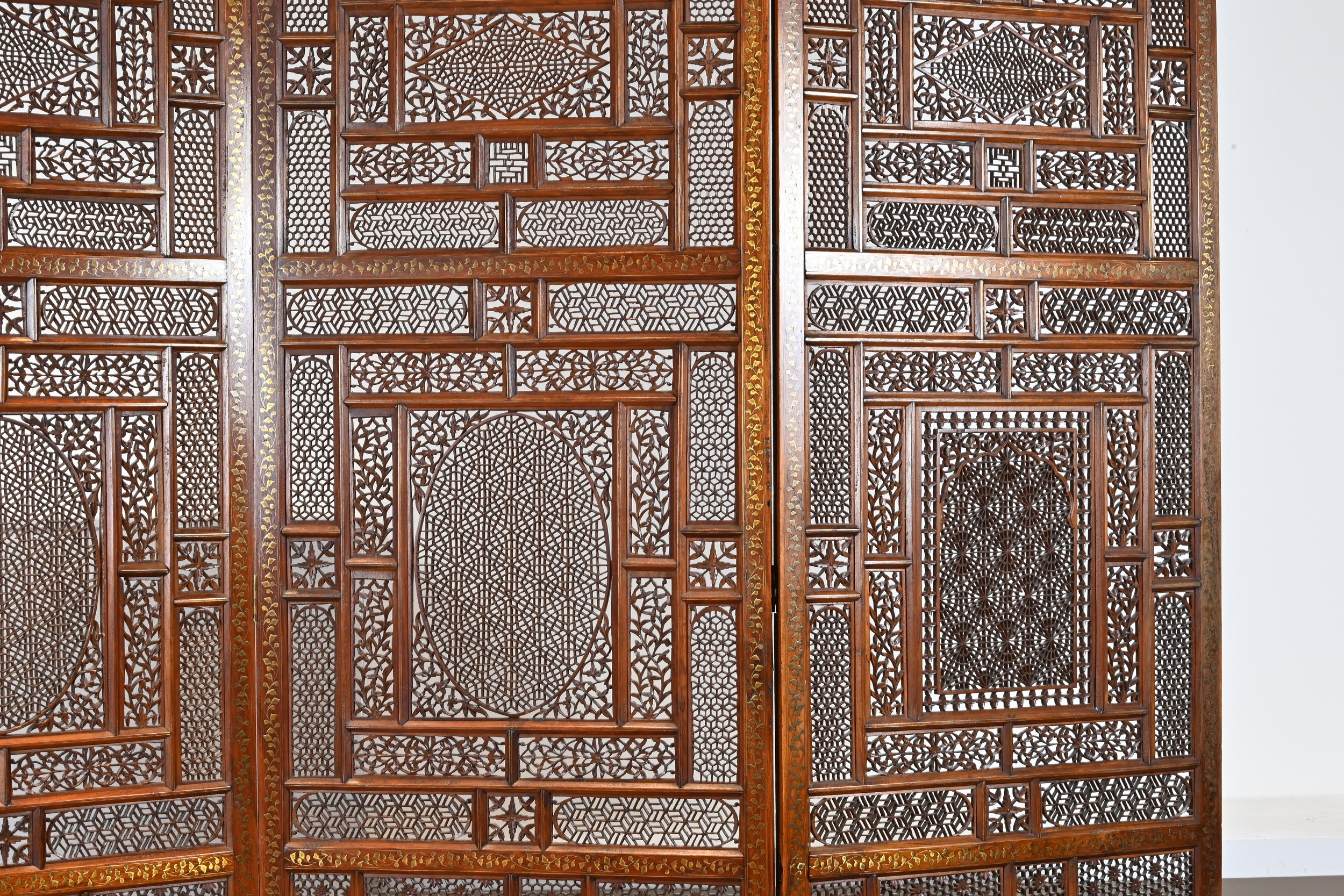 AN INDIAN FOUR PANEL TEAK WOOD AND BRASS INLAID SCREEN, 19TH CENTURY. Brass inlaid decoration to - Image 6 of 8