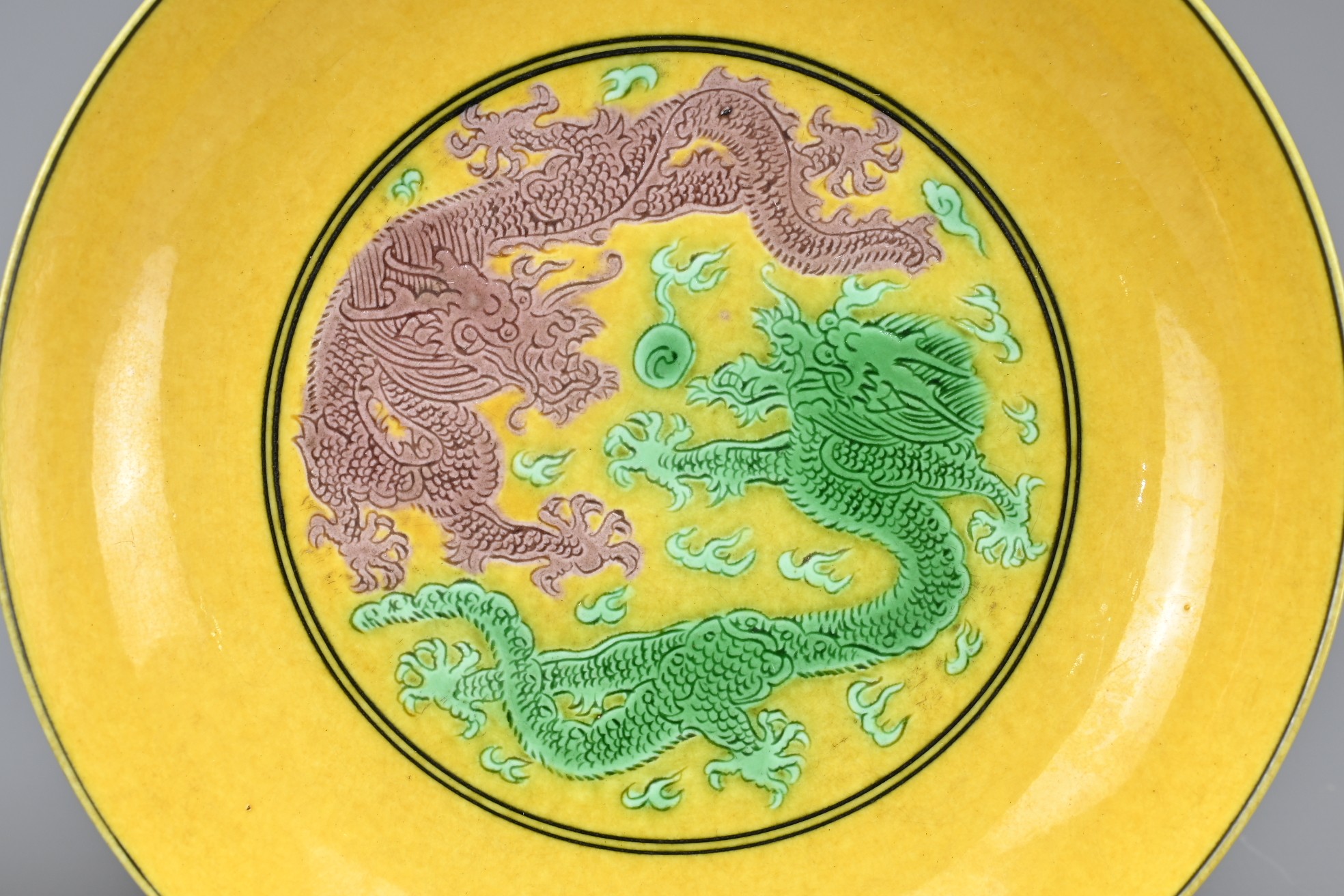 A PAIR OF CHINESE YELLOW GROUND GREEN AND AUBERGINE GLAZED DISHES, GUANGXU MARKS. Each decorated - Image 2 of 4