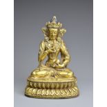 A CHINESE GILT BRONZE FIGURE OF VAJRASATTVA, INCISED XUANDE MARK. The figure seated in dhyanasana on