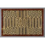 AN AFRICAN FRAMED EMBROIDERY, 20TH CENTURY, PERHAPS CONGOLESE. Woven with ivory and dark brown