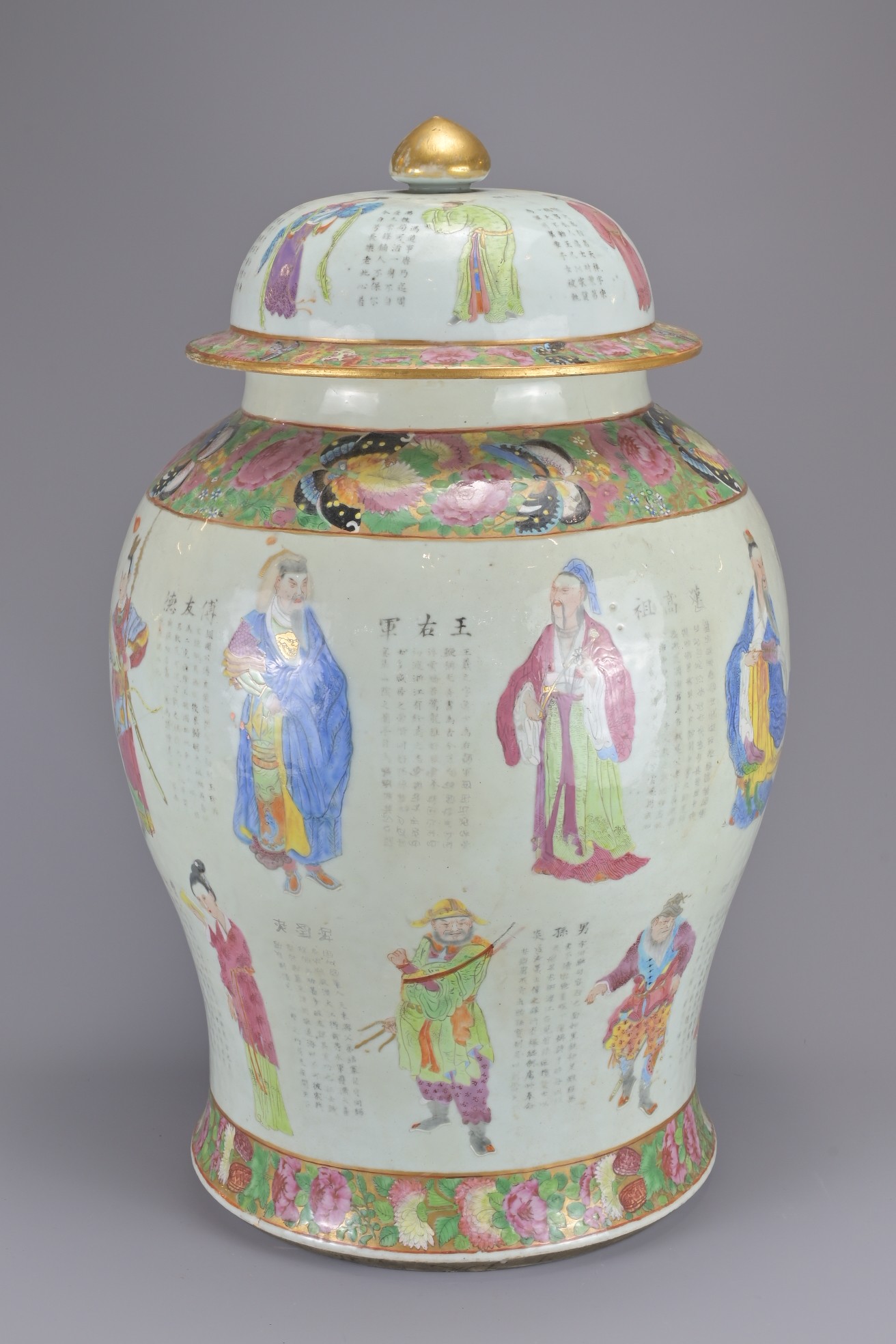 A LARGE CHINESE CANTON FAMILLE ROSE PORCELAIN BALUSTER JAR AND COVER, 19TH CENTURY. Painted to the