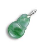 AN 18KT WHITE GOLD, DIAMOND AND JADEITE DOUBLE GOURD SHAPED PENDANT. Carved with a bug to the top,