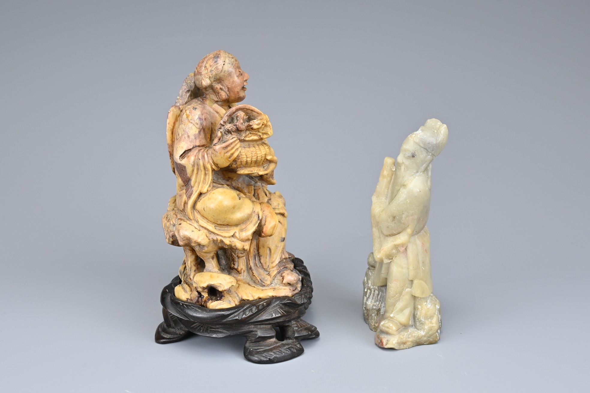 TWO CHINESE SOAPSTONE CARVINGS OF IMMORTALS, EARLY 20TH CENTURY. To include a carved figure of Lan - Image 2 of 5