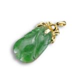 AN 18KT YELLOW GOLD, DIAMOND AND JADEITE PENDANT. The melon-shaped jadeite pendant carved with leafy