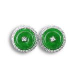 A PAIR OF 18KT WHITE GOLD, DIAMOND AND JADEITE EARRING STUDS. Each disc-shaped and centred with a