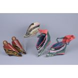 A PAIR OF CHINESE EMBROIDERED SHOES, ANOTHER SIMILAR AND A PAIR OF LACQUERED WOODEN MODELS OF