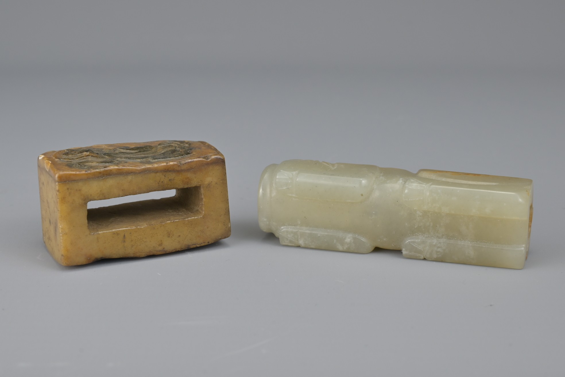 TWO CHINESE JADE FITTINGS. To include a celadon and russet animal form section of cylindrical - Image 6 of 6