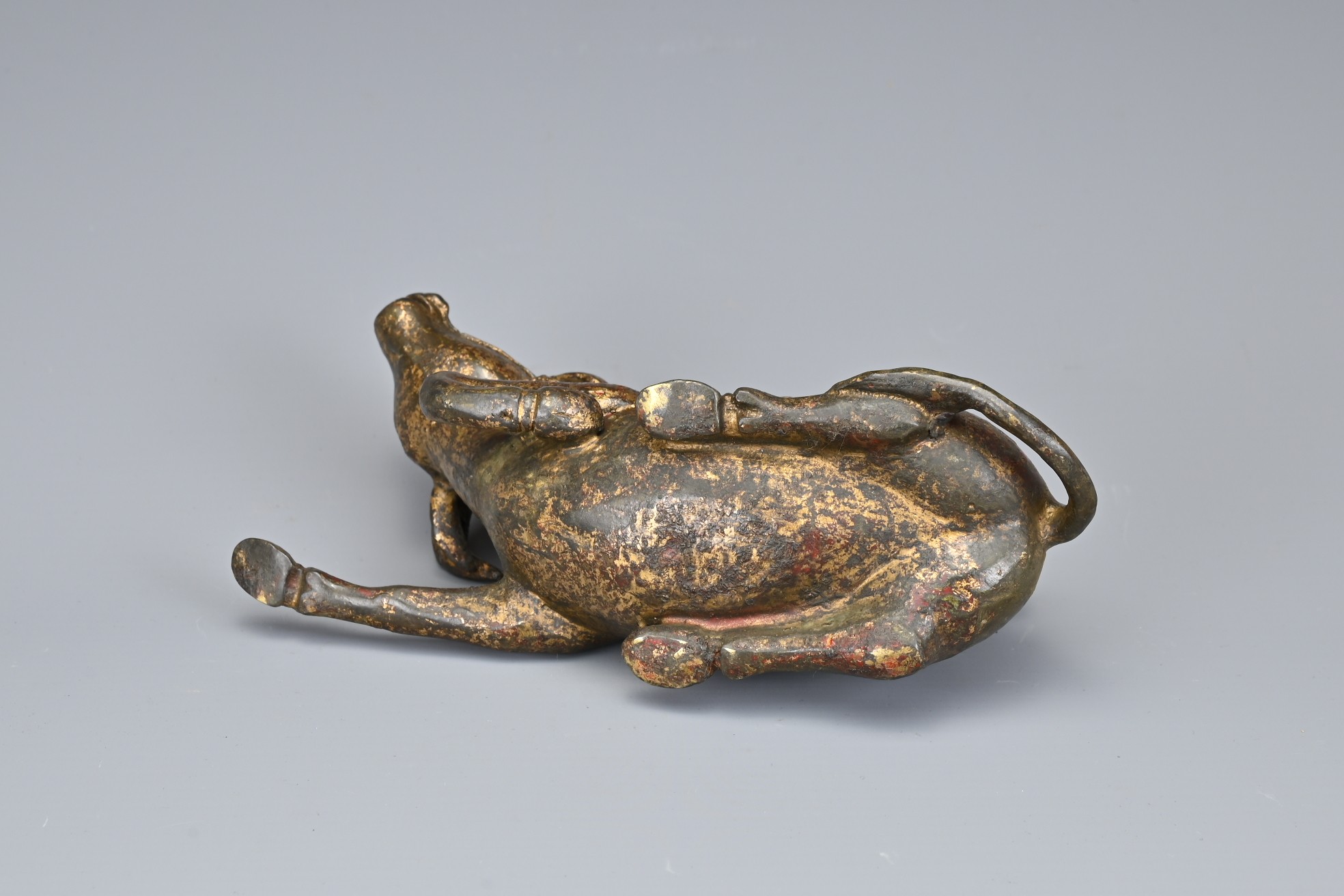 A CHINESE GILT BRONZE MODEL OF A BUFFALO AND BOYS. The recumbent buffalo wearing a rein with on - Image 6 of 7