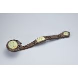 A VINTAGE CHINESE RUYI SCEPTRE. Carved and pierced wood sceptre with celadon jade inserts to the