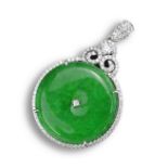 AN 18KT WHITE GOLD, DIAMOND AND JADEITE CIRCULAR SHAPED PENDANT. Centred with a diamond, within