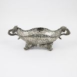 A reticulated silver basket