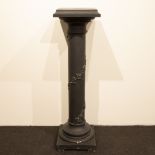 Black colored wooden column with garlands