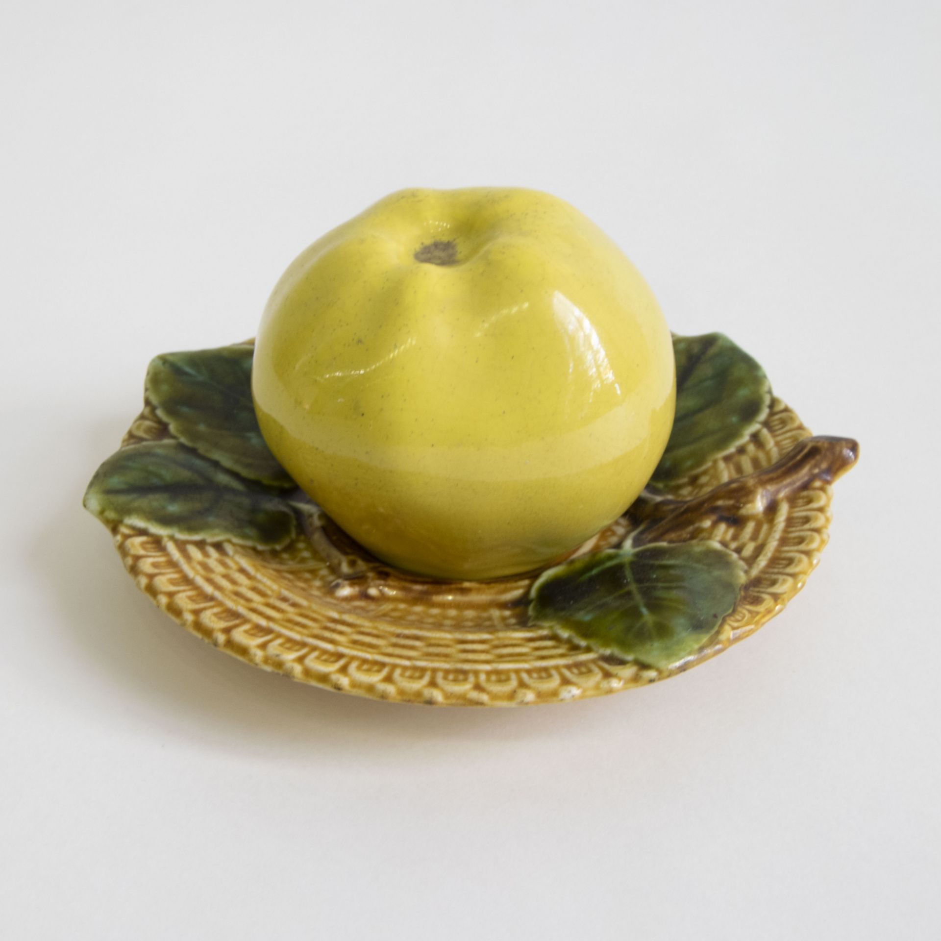 A Majolica Boch Inkwell in the form of an apple on a saucer