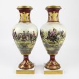 A pair of Napoleonic Empire style polychrome porcelain vases.