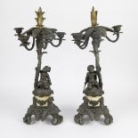 A pair of candelabra's marble and bronze decorated with girl and boy