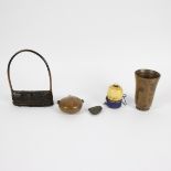 A collection including a wooden cup, a pendantmade out of horn, African rattle, wooden bottle and a