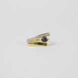 Gold ring 18 kt with diamonds and sapphire