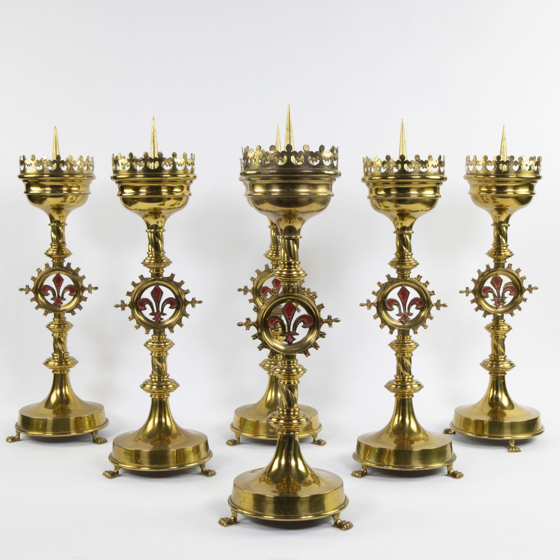 A collection of neo-gothic church candlesticks (6) in brass