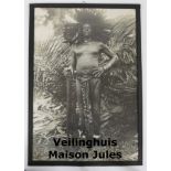 Photo of African tribe chief with traditional feather hair dress from the collection of District Com