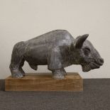 Large bull in stone on wooden pedestal